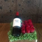Caja de madera con 12 rosas